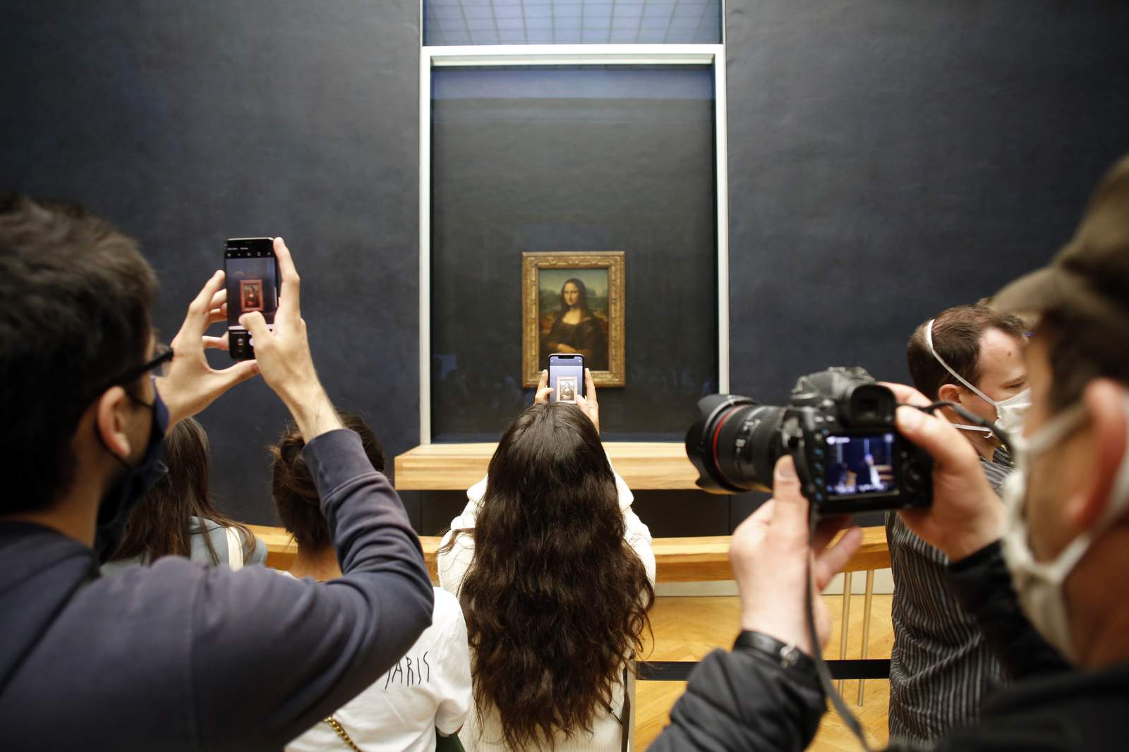 "Mona Lisa" back at work, visitors limited as Louvre reopens