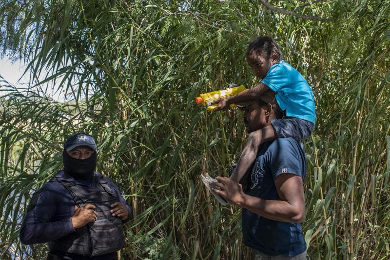 Migrant camp shrinks on US border as more Haitians removed