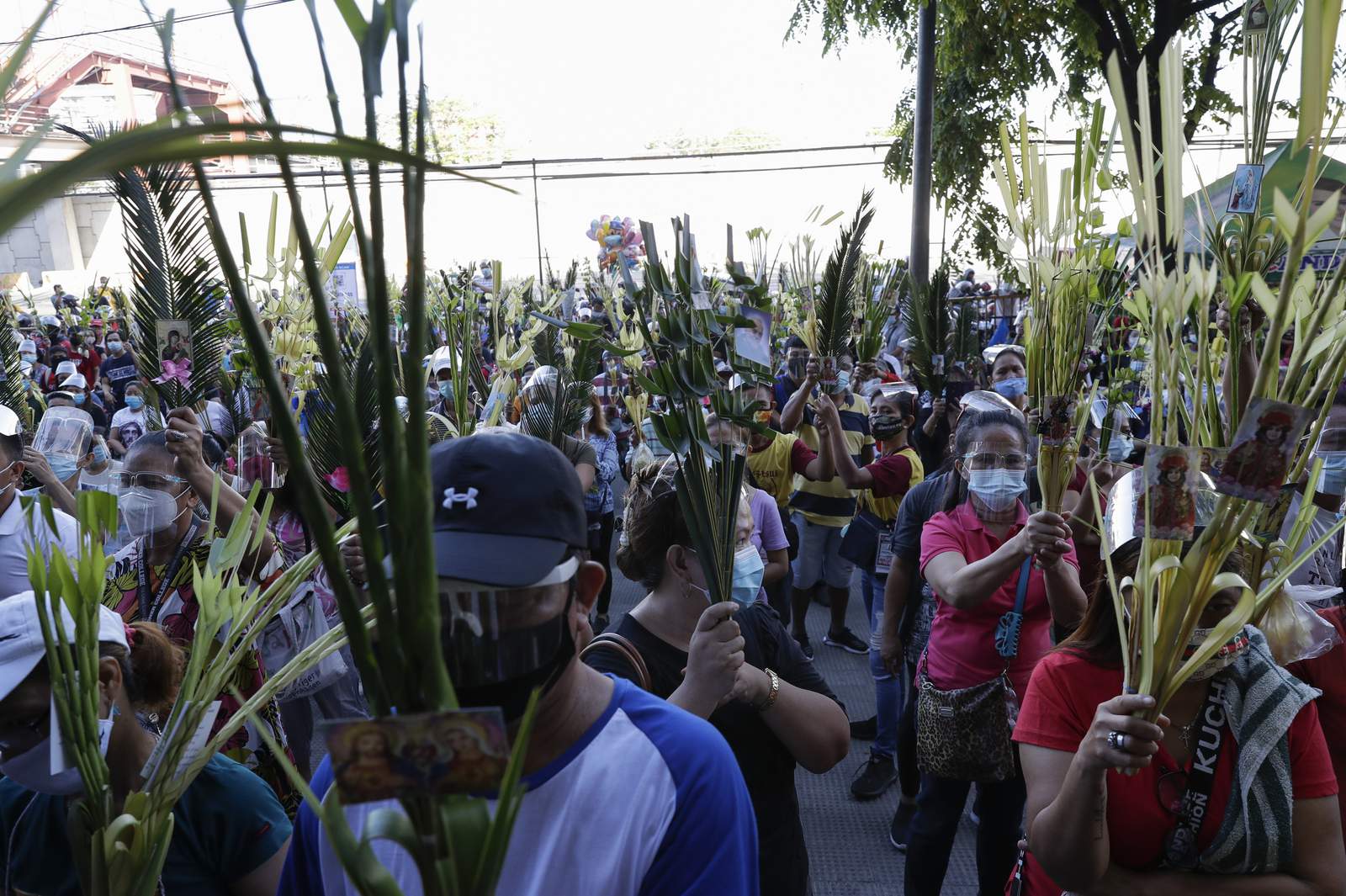 The Latest: Metro Manila, outlying provinces go on lockdown