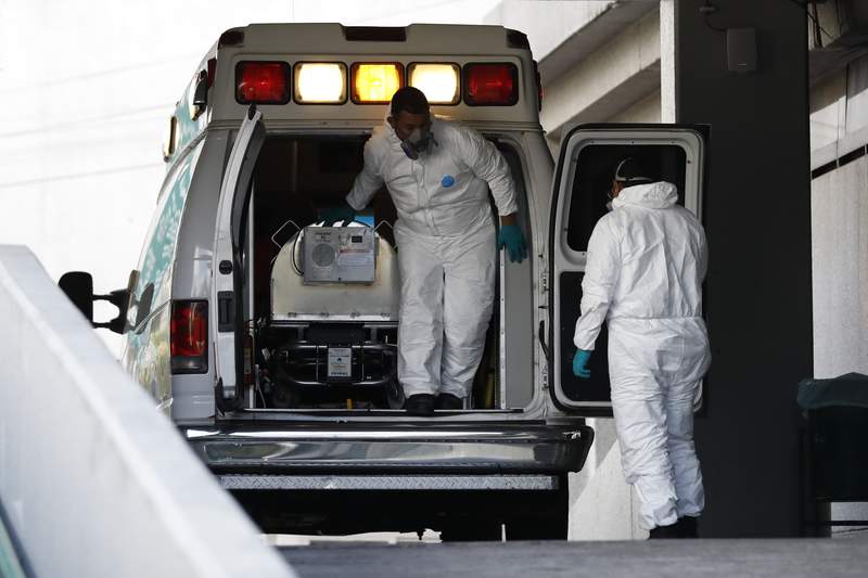 Patients wait in ambulances outside Florida hospitals as COVID-19 infections spread