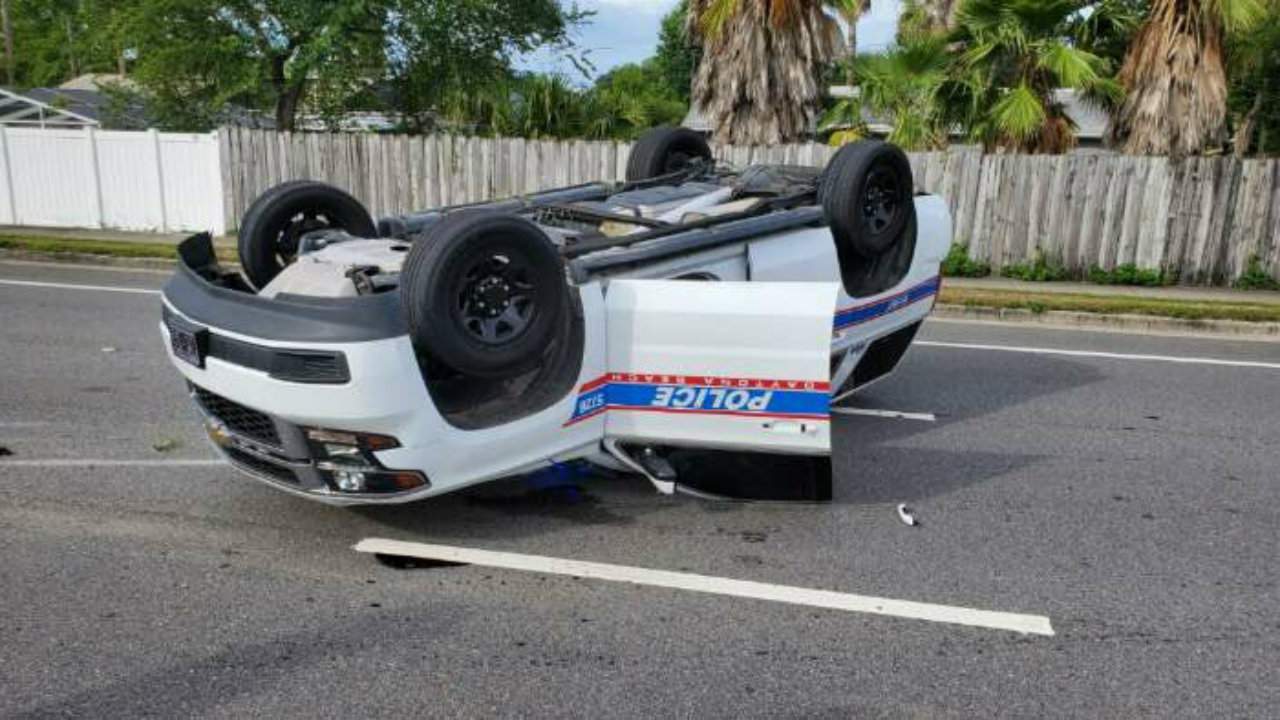 PHOTOS: Police car flips over after chase in Daytona Beach
