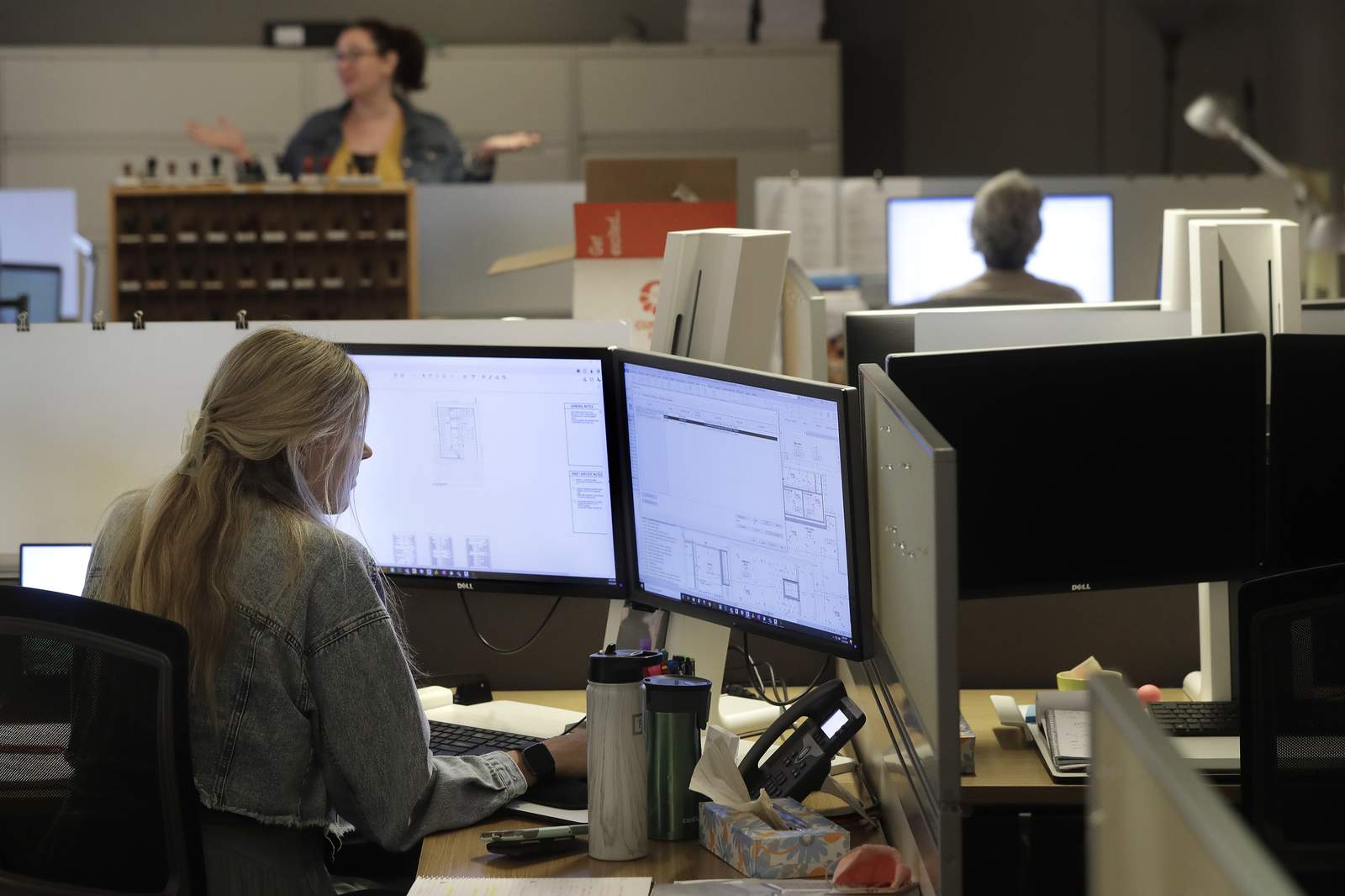 Taller cubicles, one-way aisles: Office workers must adjust