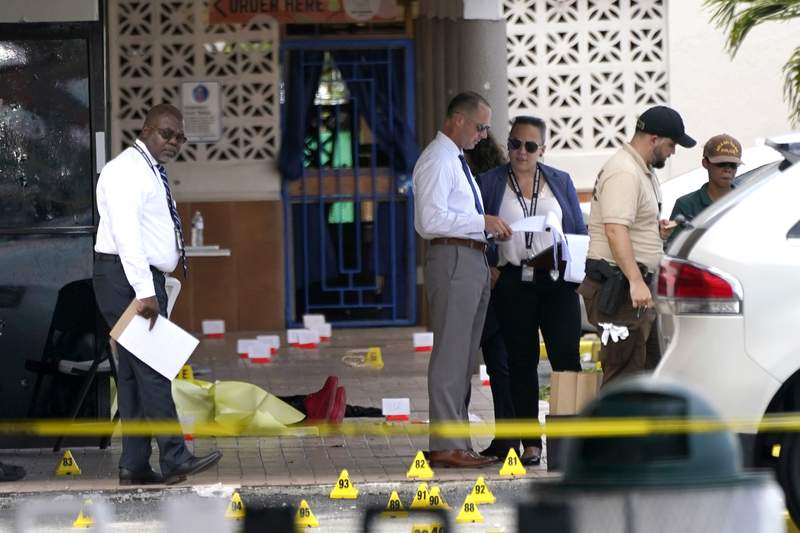 Amid grief, manhunt in Miami continues for 3 shooters