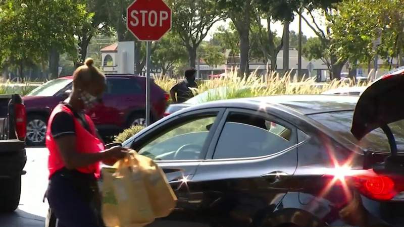 ‘It’s a real blessing:’ Orange County families struggling during pandemic line up for free food