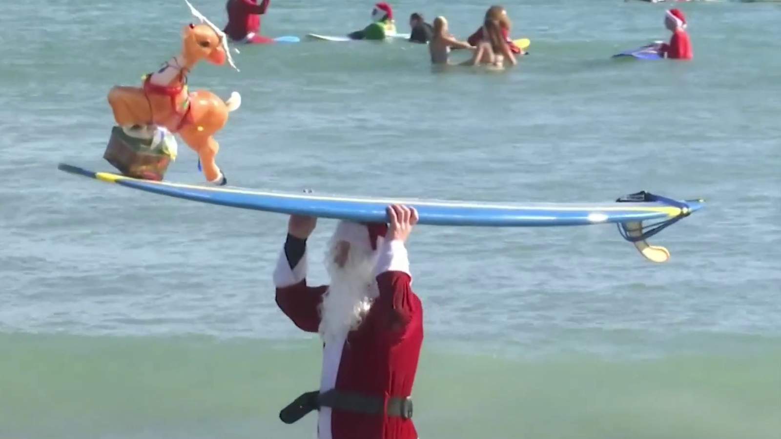 Surfing Santas scales back annual Christmas Eve event during coronavirus pandemic