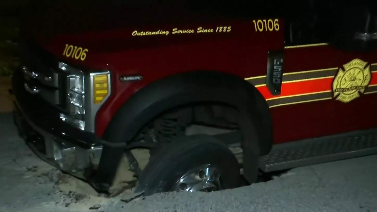 Ambulance falls into possible sinkhole in Orlando neighborhood