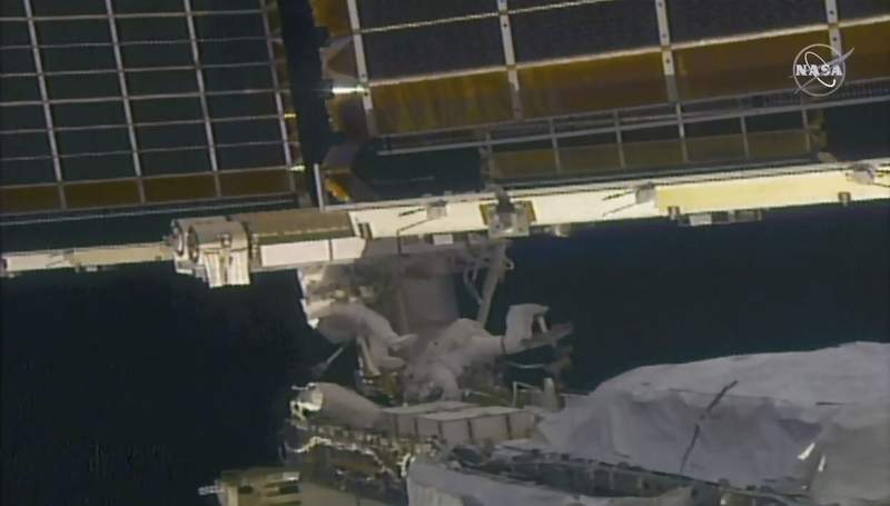 NASA astronauts successfully install 1 of 2 new solar arrays for space station