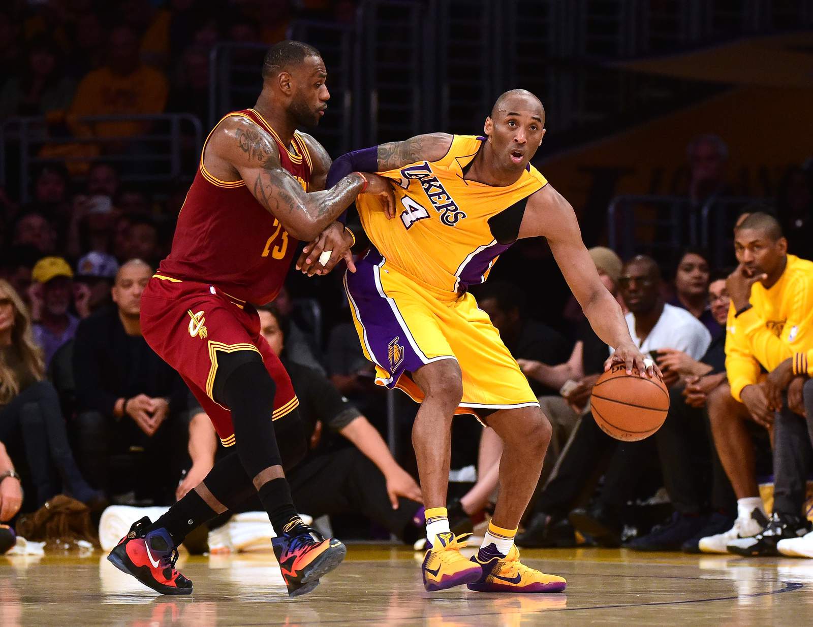 Kobe Bryant backs in on LeBron James in the first half of a game vs. the Cavaliers on March 10, 2016.