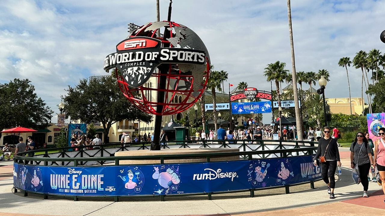 Runners lace up shoes for 2022 Disney Wine & Dine Half Marathon Weekend