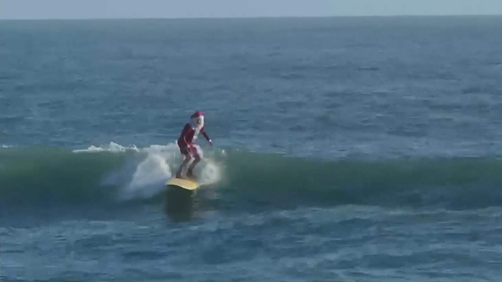 Surfing Santas goes virtual, hundreds of families still flock to Cocoa Beach