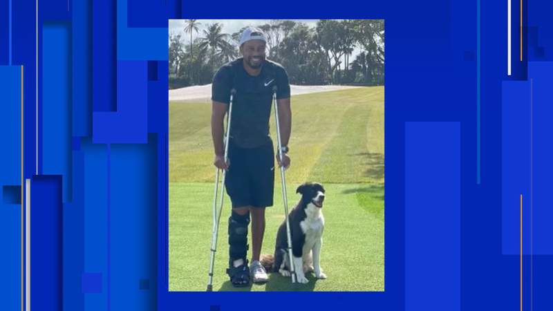Tiger Woods, in cast and crutches, posts photo with dog in Florida