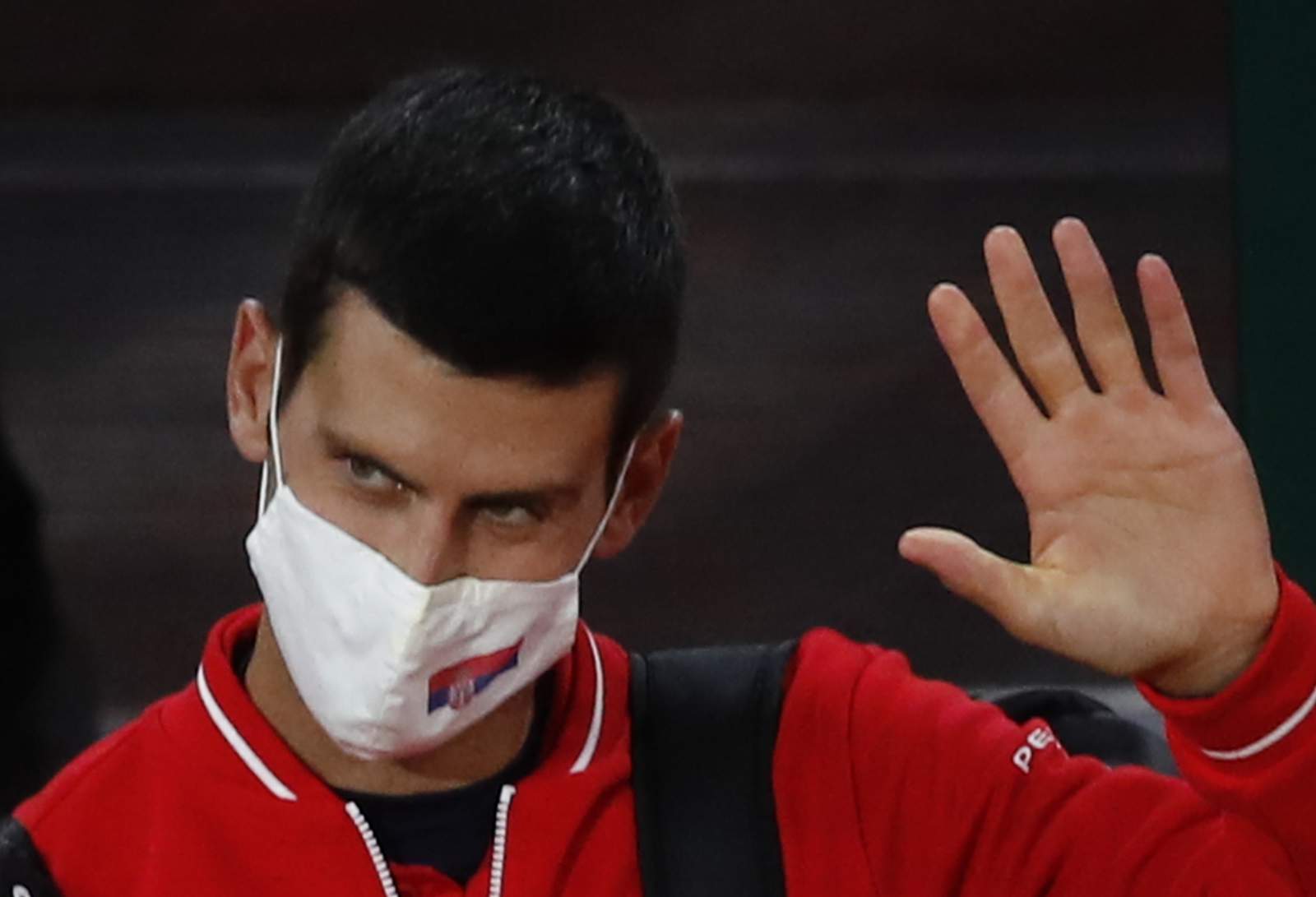 The Latest: Djokovic in 11th French Open quarterfinal in row