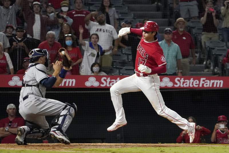 Astros move closer, beat Angels in 12; Ohtani out at plate