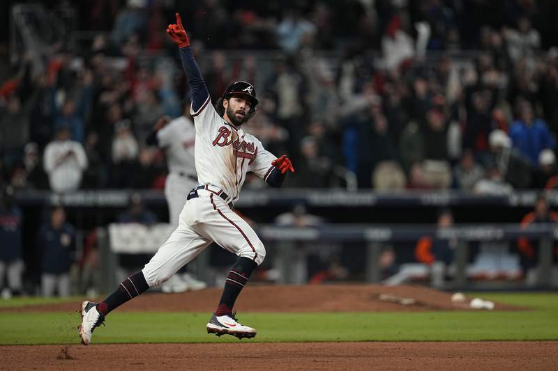 Unlikely hero, 2 HRs carry Braves to brink of Series title