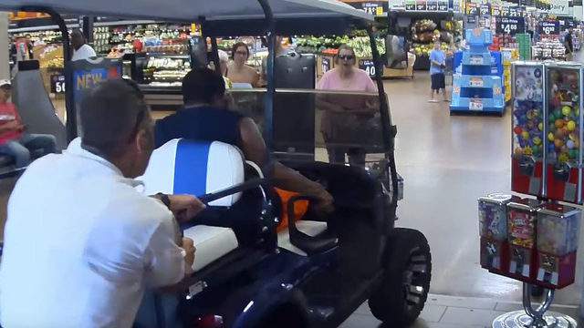 Video Man Drives Golf Cart Through Crowded Entrance At Florida Walmart