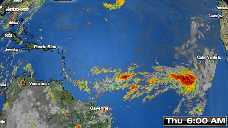 Hurricane center monitoring 2 tropical waves