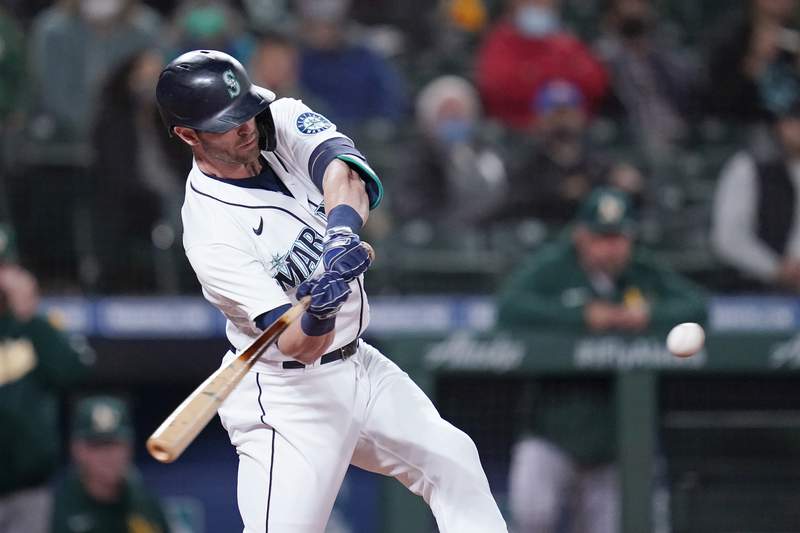 Haniger hits 2 HRs, M's beat A's to gain in wild-card race