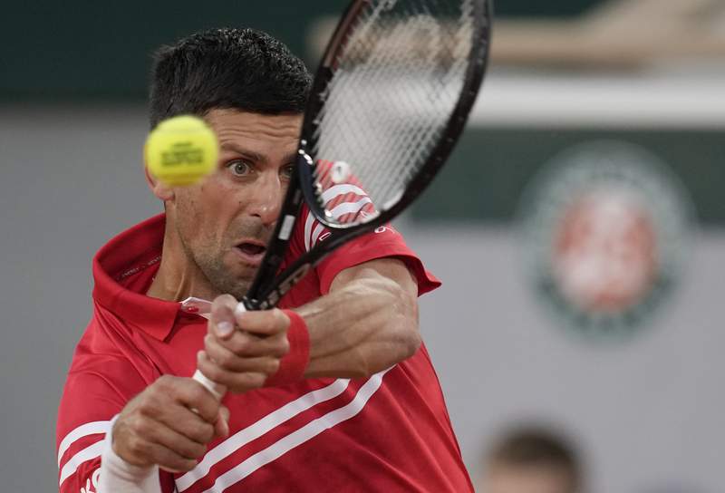The Latest: Djokovic improves to 17-0 in French Open 1st Rd