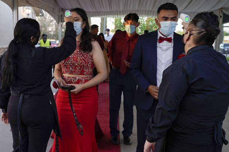 Some proms are back, with masks, testing and distancing