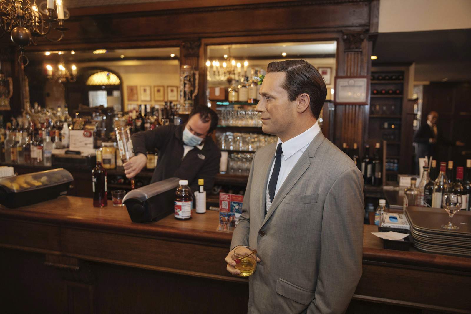 NYC steakhouse stunt: A wax Don Draper hanging at the bar