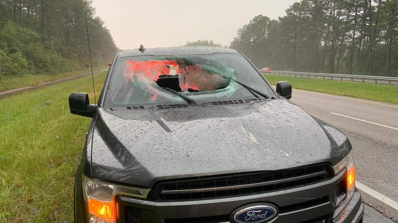 PHOTOS: Florida lightning strike sends road debris through truck windshield