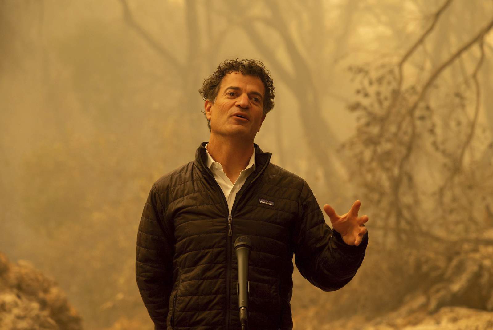 Amid ashes, California governor fires away on climate change