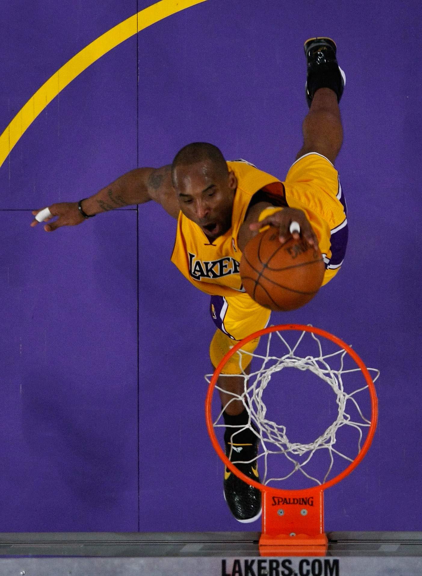 Kobe Bryant dunks with his left hand in the third quarter against the New Orleans Hornets in Game 5 of the Western Conference Quarterfinals in the 2011 NBA Playoffs.