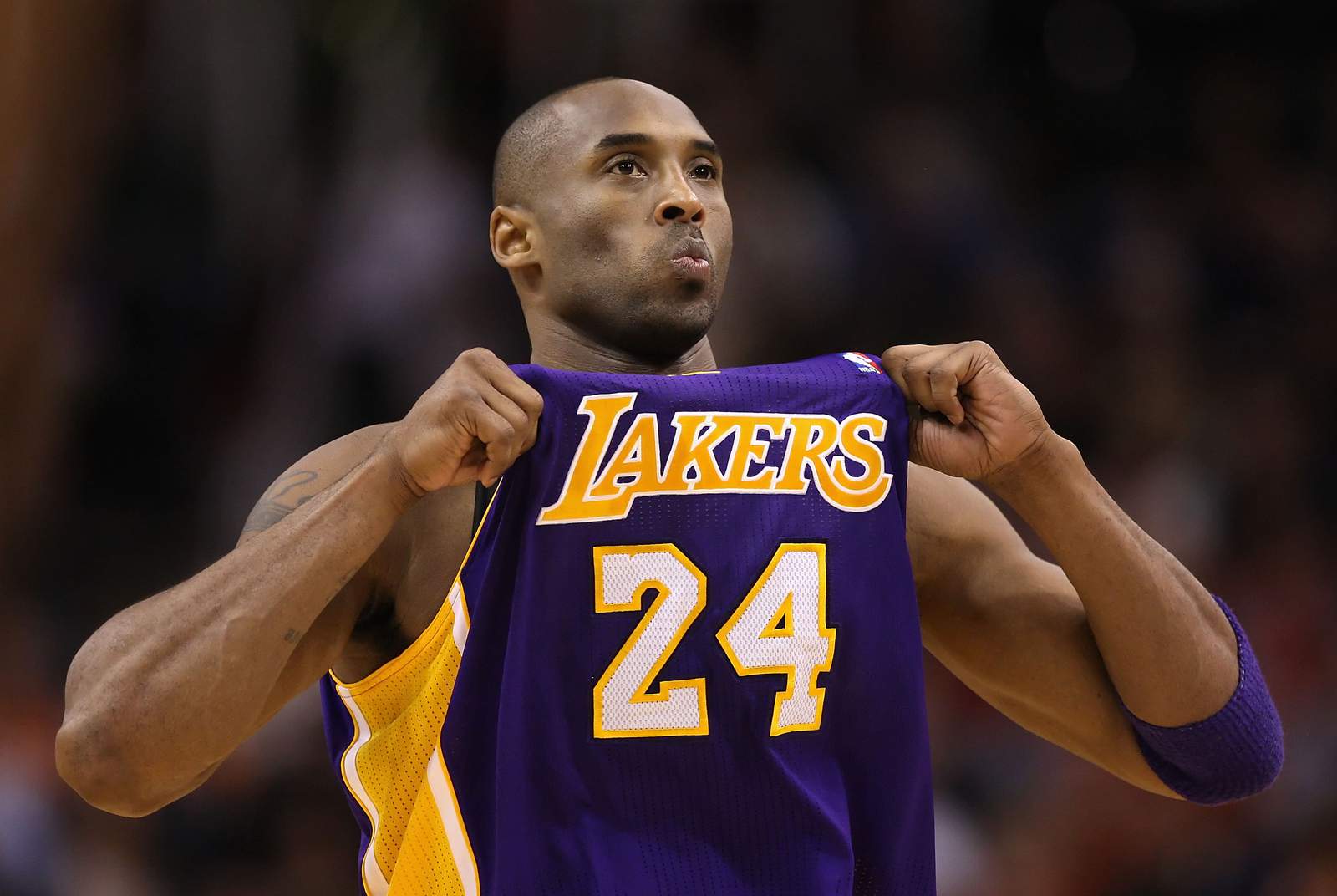 Kobe Bryant adjusts his jersey during a game vs. the Phoenix Suns at the U.S. Airways Center on Feb. 19, 2012.