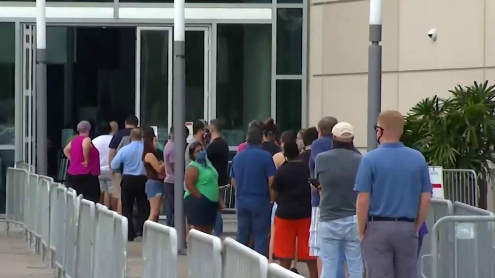 Dozens of pastors march to Amway Center to vote early