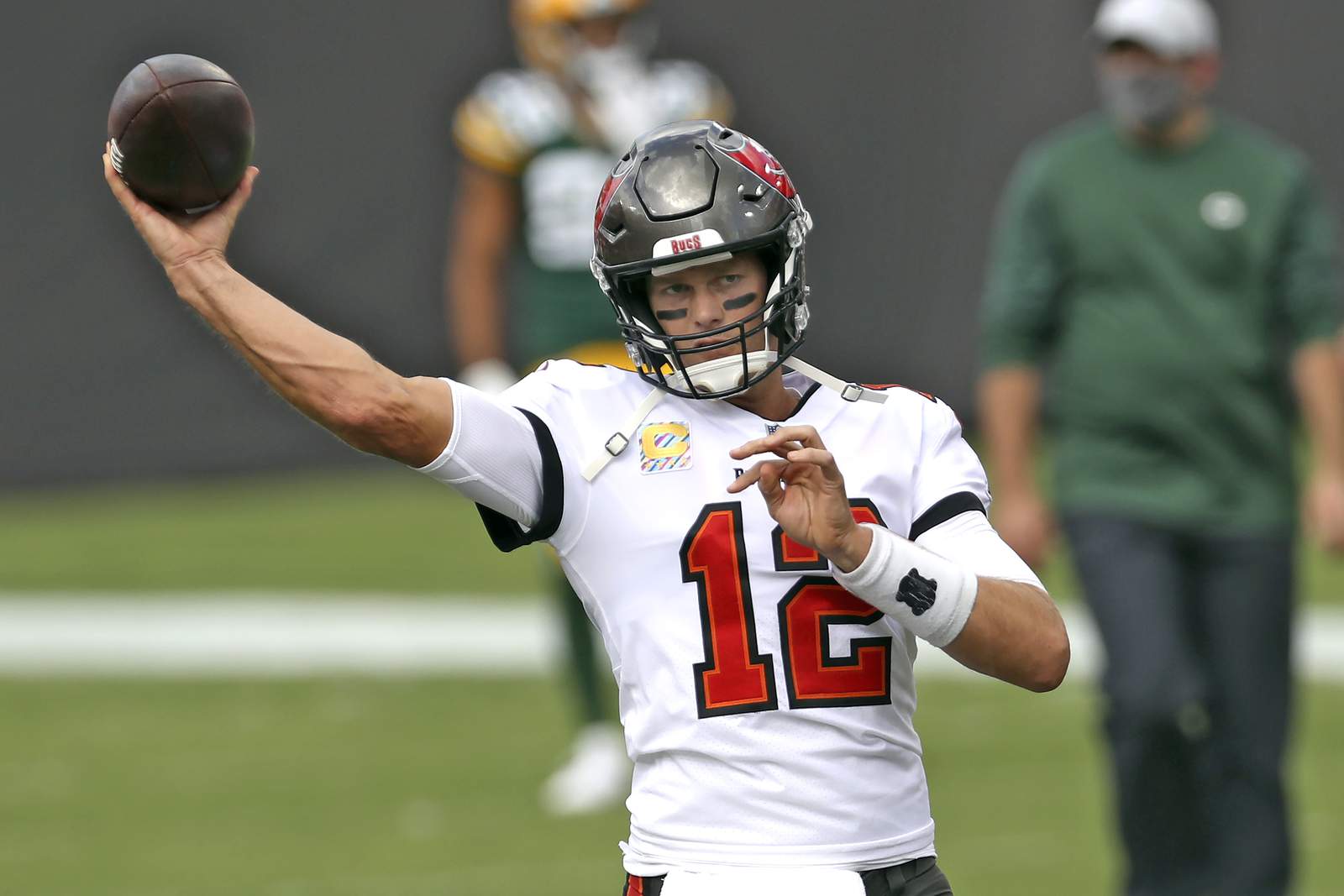 The Latest: Brady, Bucs roll to win, give Packers first loss