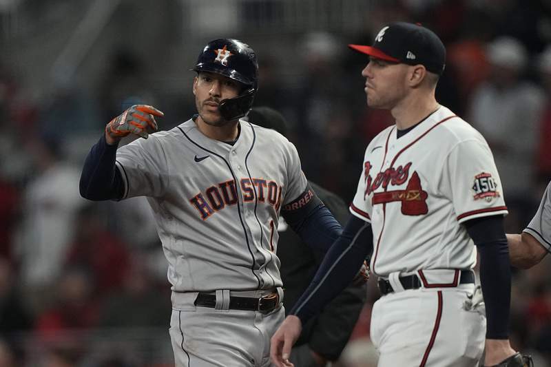 The Latest: Astros force series back to Houston with 9-5 win