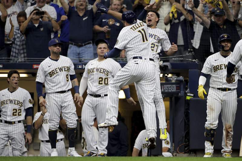 Tellez HR, throw spark Brewers over Braves 2-1 in Game 1