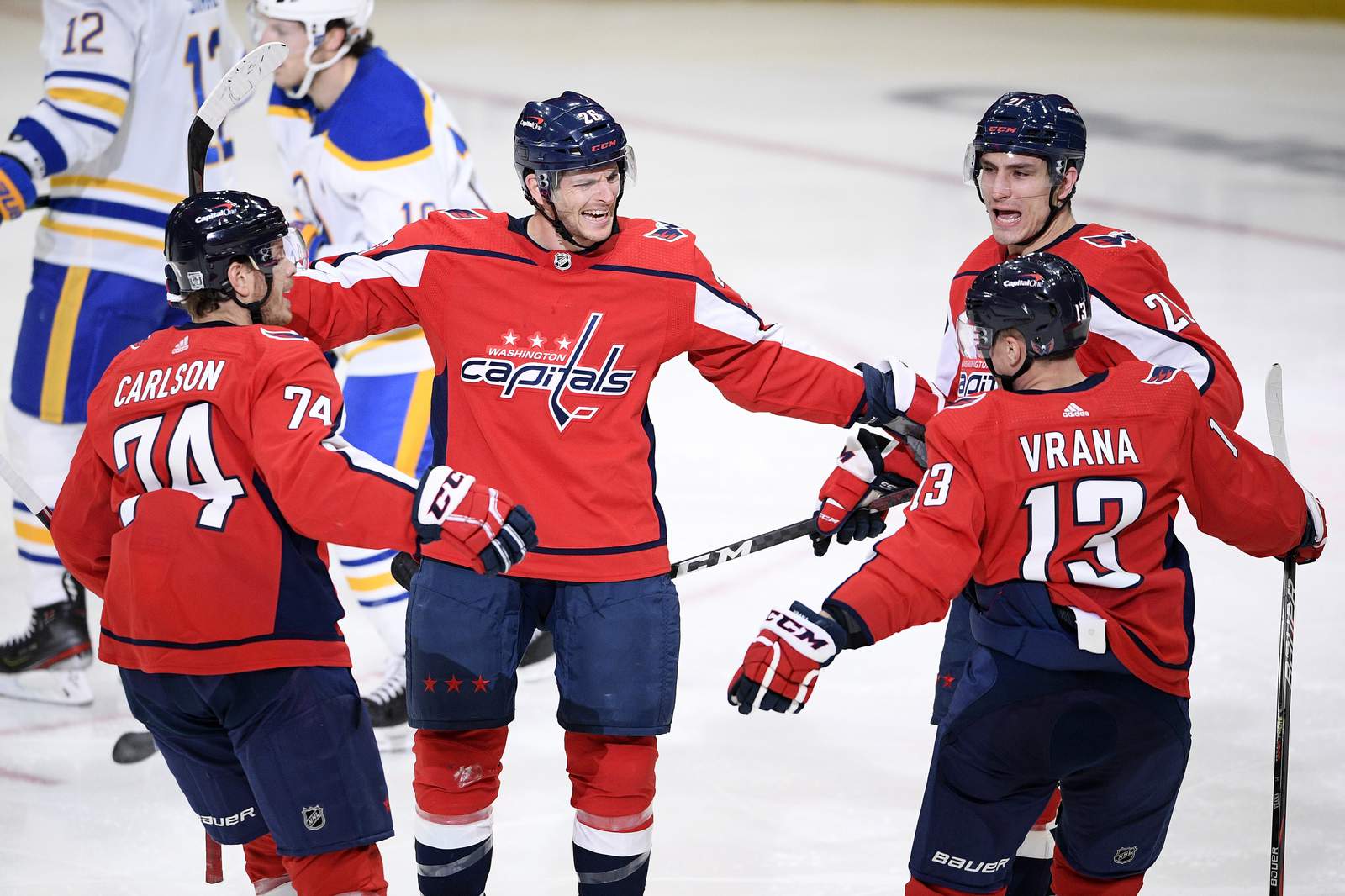 Shorthanded Capitals beat Sabres 4-3 in home opener shootout