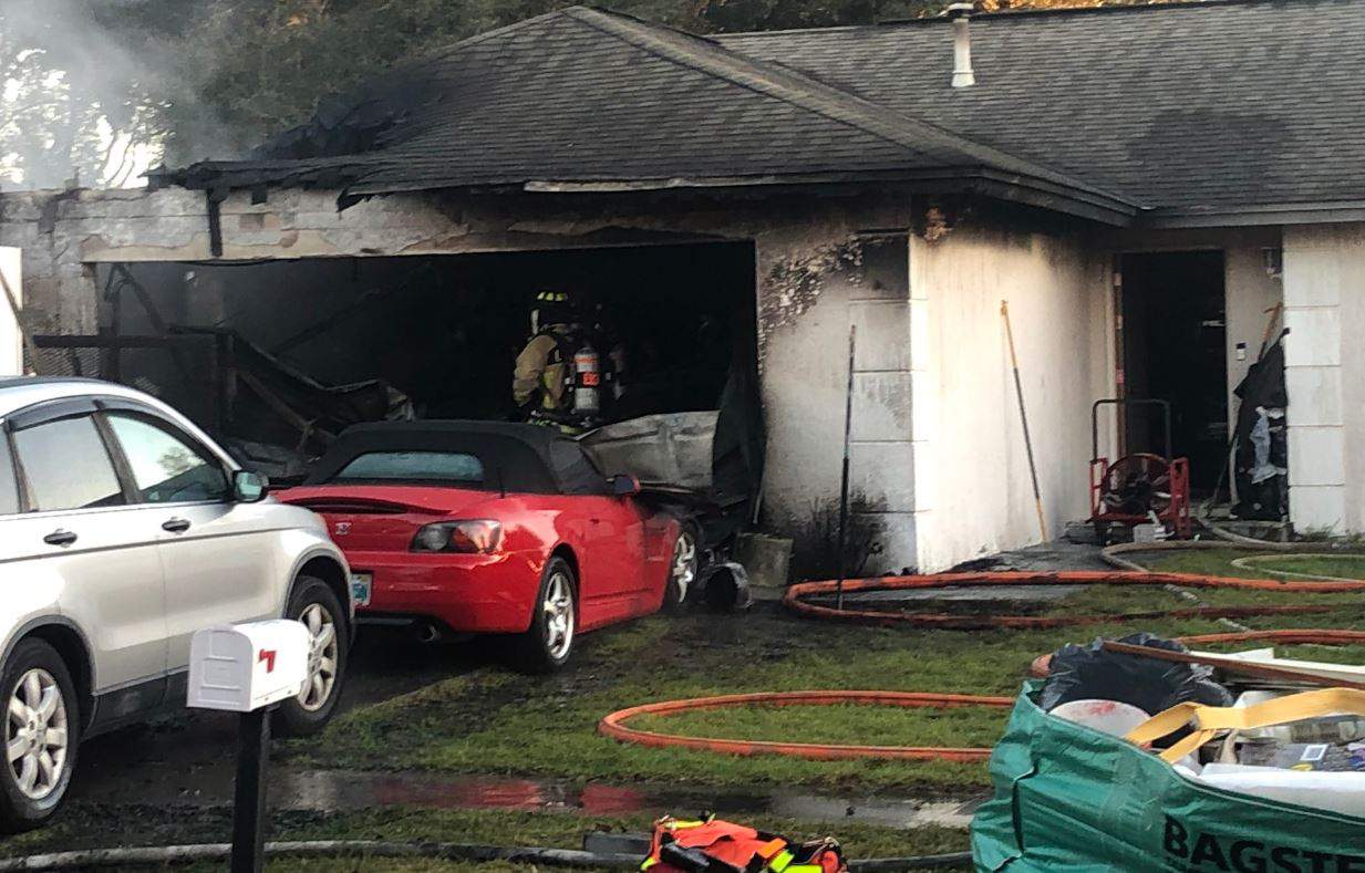 Cars damaged in house fire near Clermont