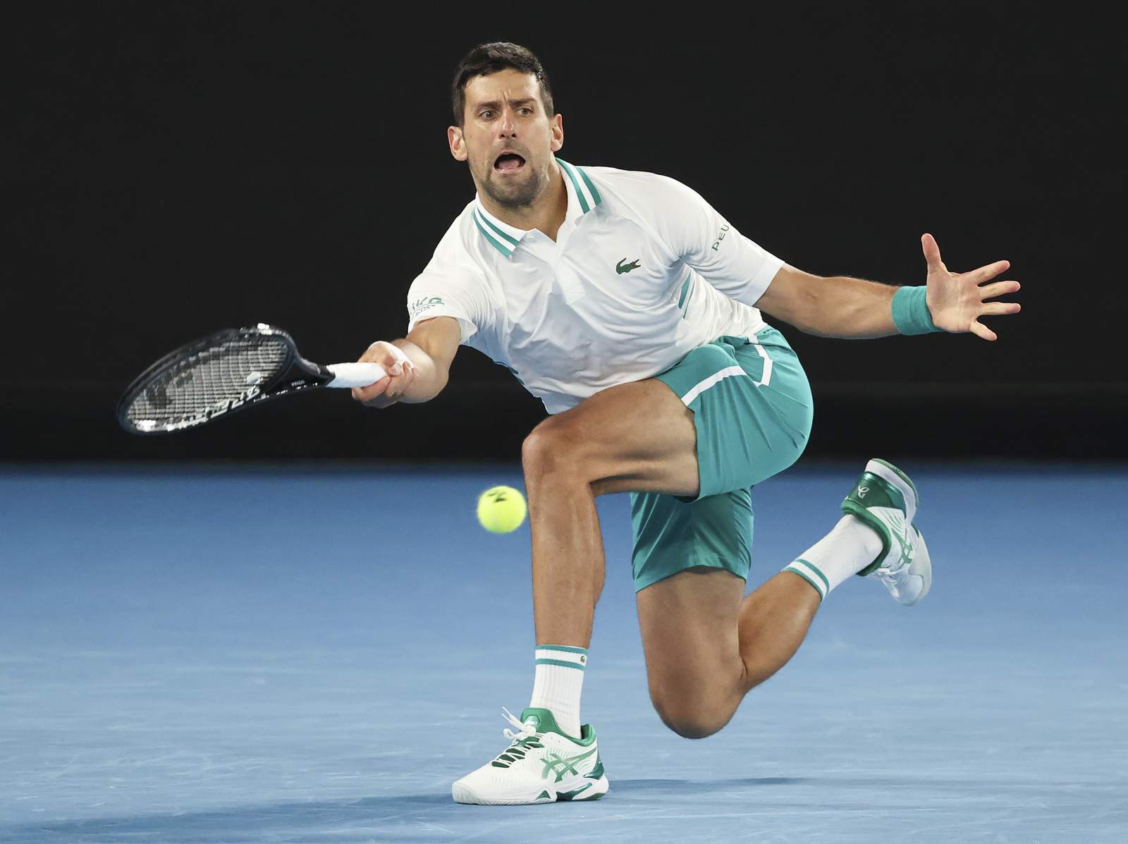 The Latest: Djokovic beats Raonic, reaches QFs in Australia