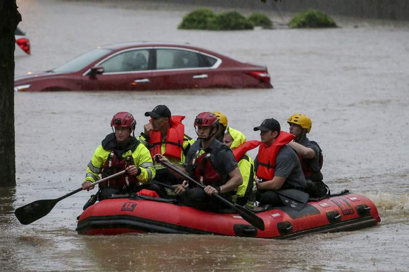 Wind, rain pound South amid flood fears and water rescues