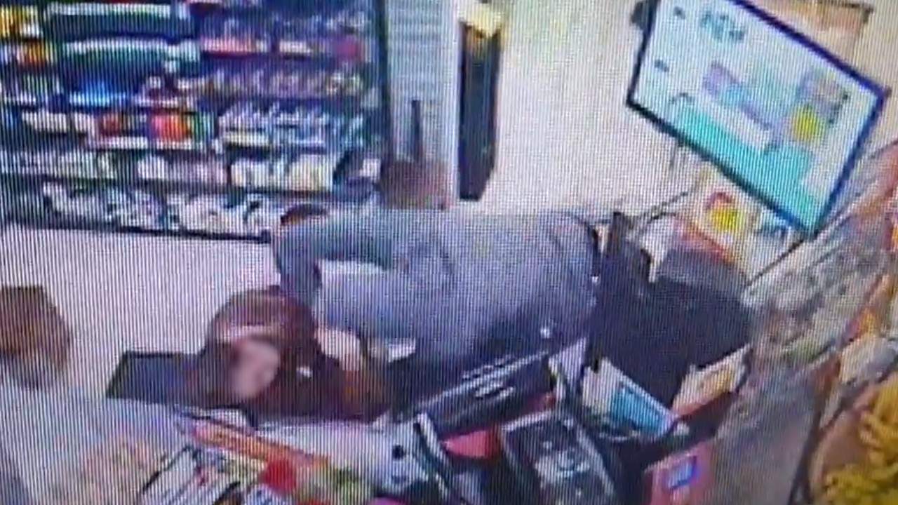 Video shows male attacking clerk before stealing from register