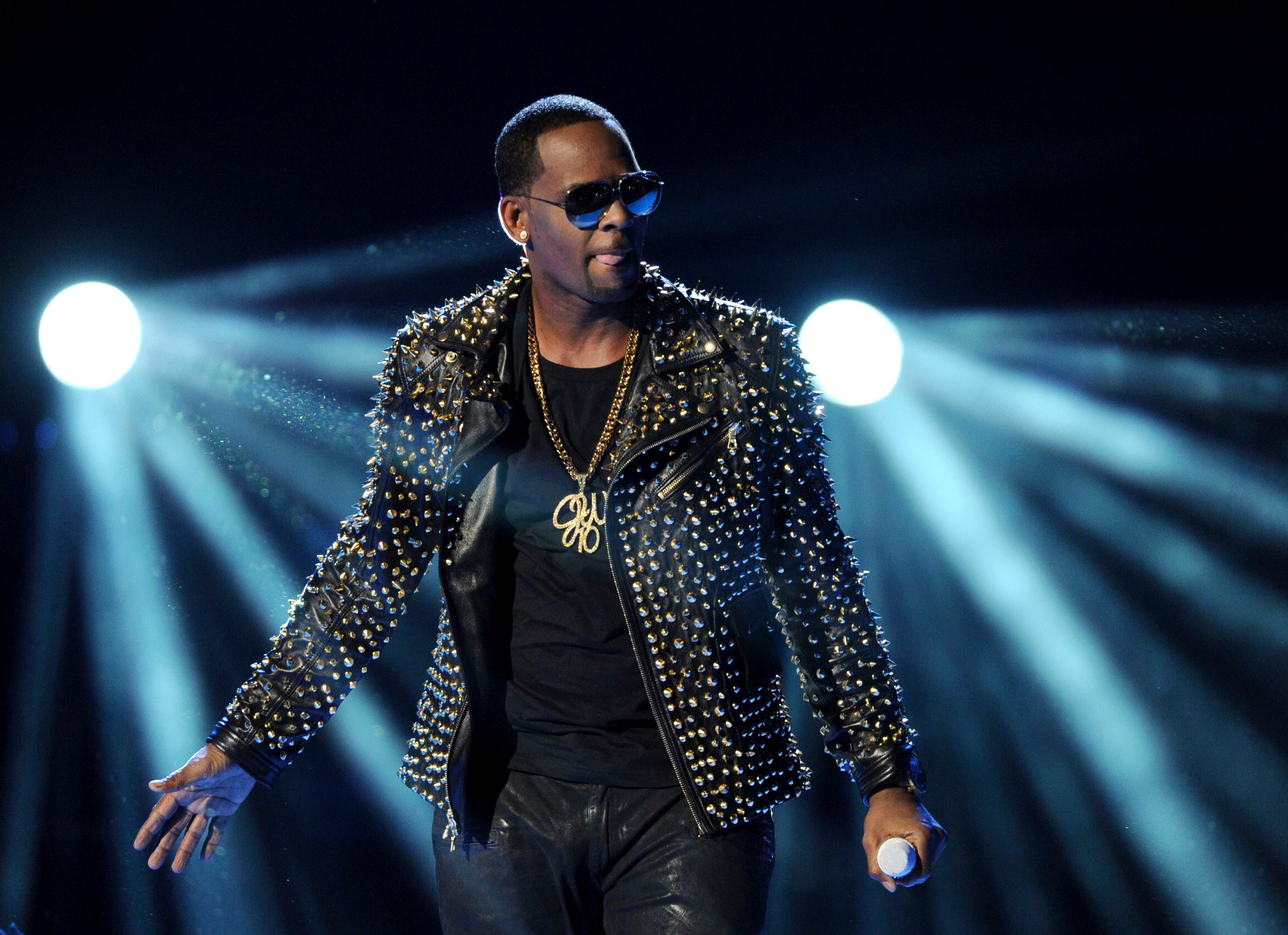 Woman describes frequent abuse by R Kelly before she was 18
