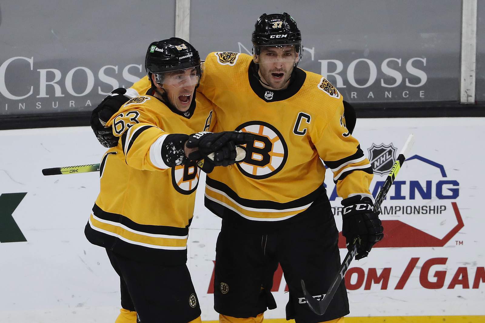 Marchand carries Bruins' big 2nd and past Penguins, 7-5