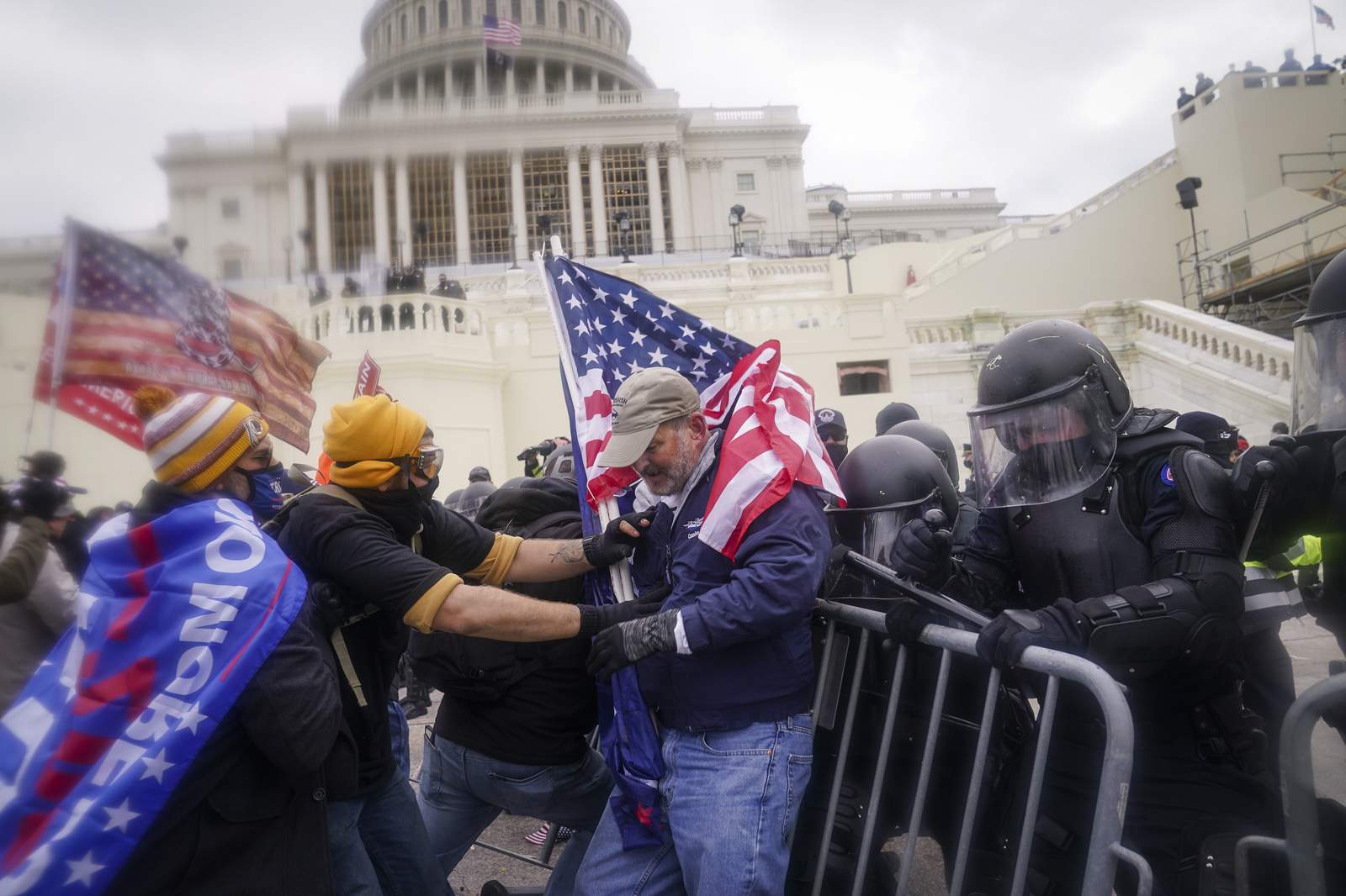 Dozens charged in Capitol riots spewed extremist rhetoric