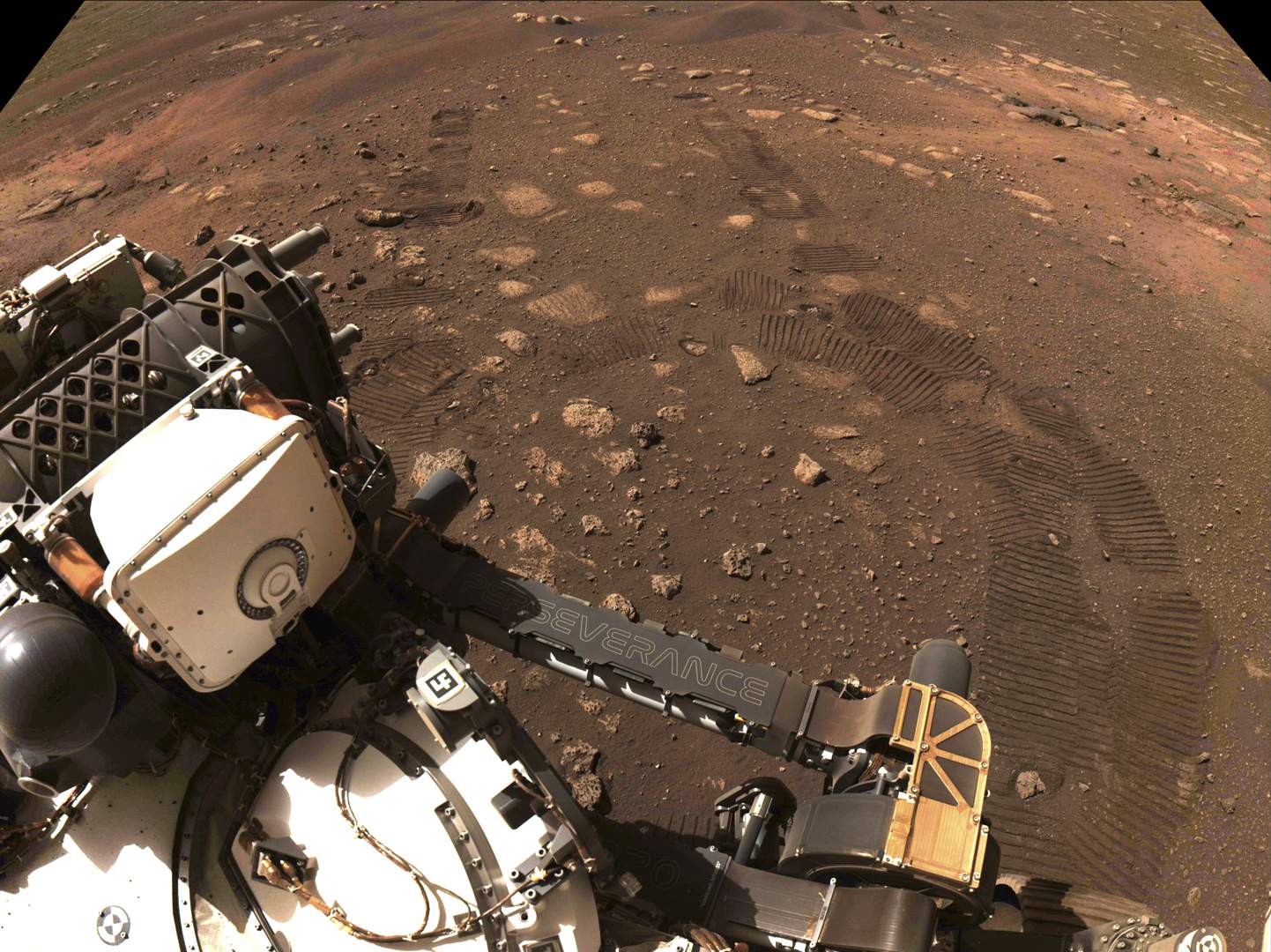 NASA's new Mars rover hits dusty red road, 1st trip 21 feet