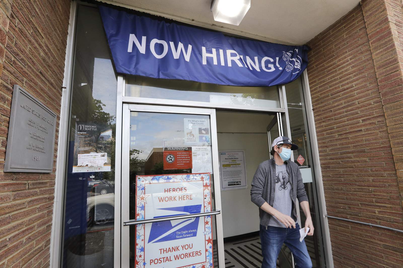 Demand for jobless aid high, even as economy slowly picks up