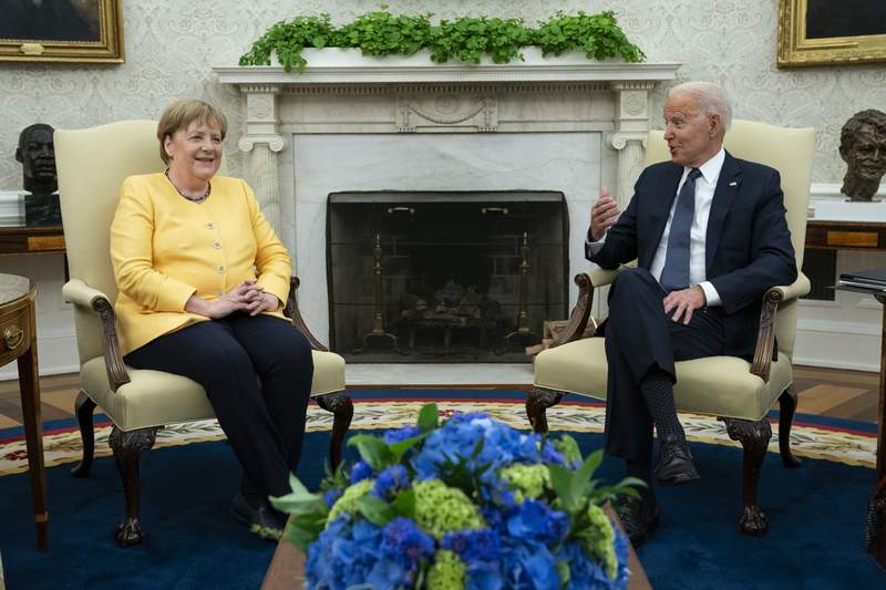 Biden bids Merkel farewell: Friends — with disagreements