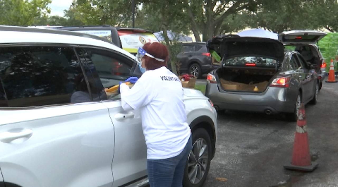 Residents continue to rely on drive-thru food pantries months after being furloughed